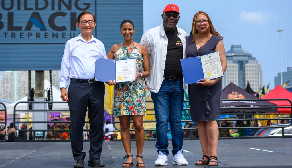 Councillors Dr. Raymond Chew and David Smith presentations to Carnival Executives 