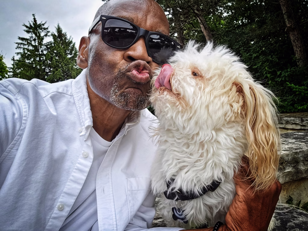 Glen E Grant Toronto photographer with small white dog selfie.